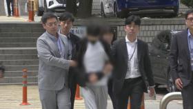 경복궁 담벼락 낙서 배후 '이 팀장' 구속심사 출석