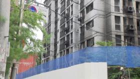 광명 아파트 화재, 호우 속 대피 생활...최초 신고자 조사